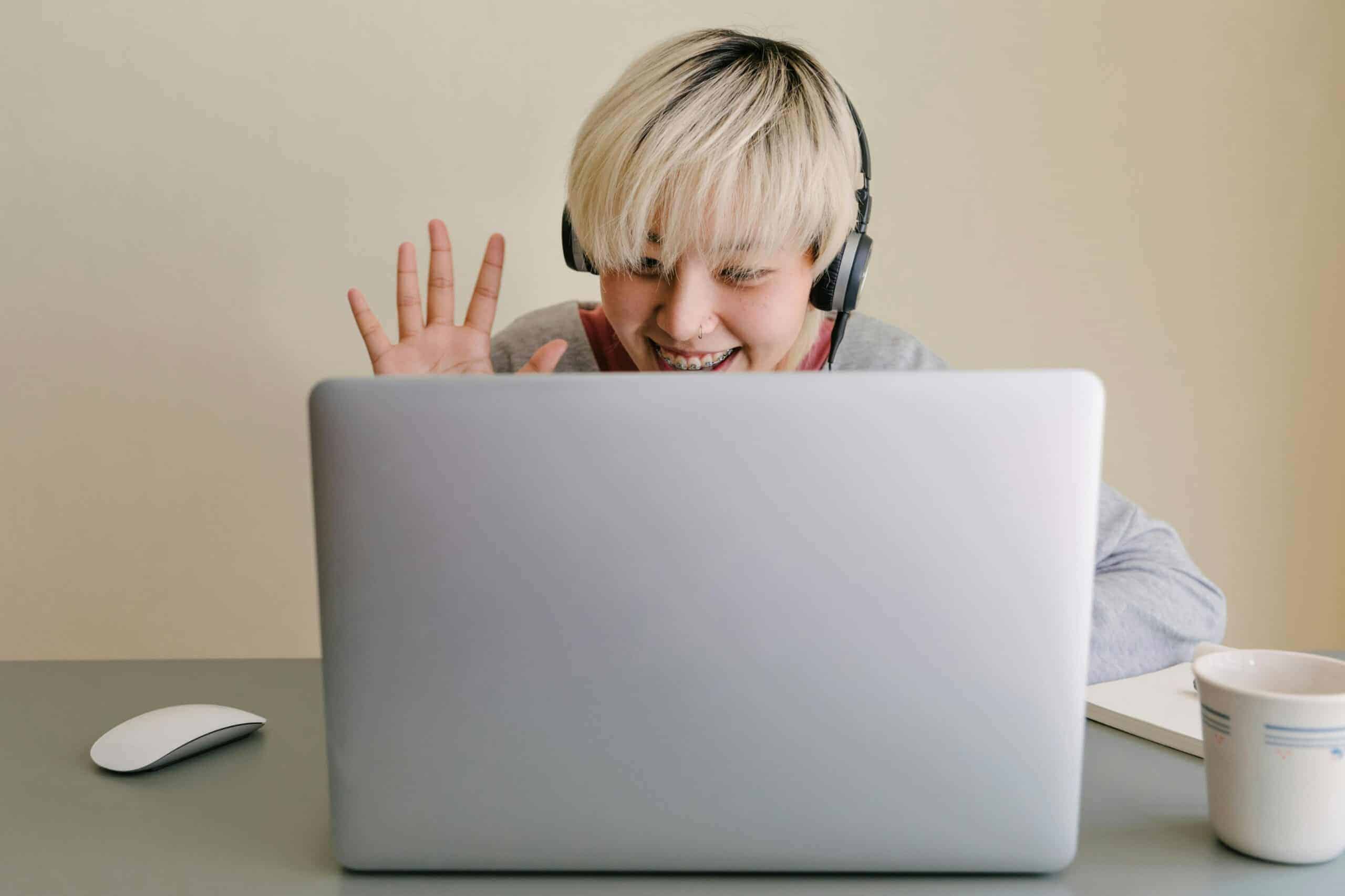 person using a webinar software on laptop